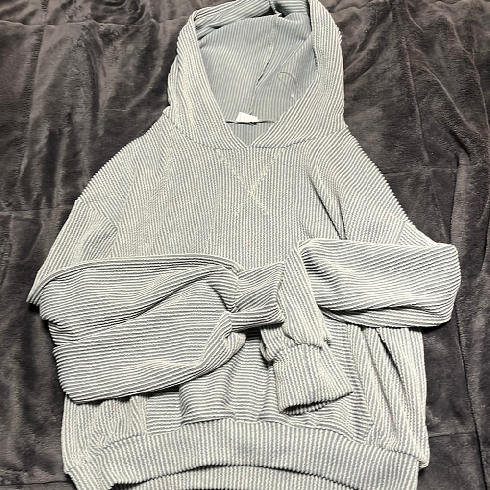 Light grey ish blue lightweight sweatshirt with hood and front pocket